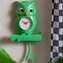 Nástěnné hodiny s kyvadlem sova OWL zelené KARLSSON