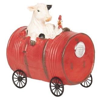 Kráva se slepicí v pojízdném sudu