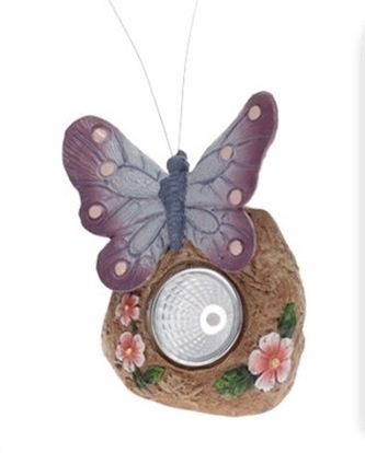 Solární světlo fialový motýl na kameni