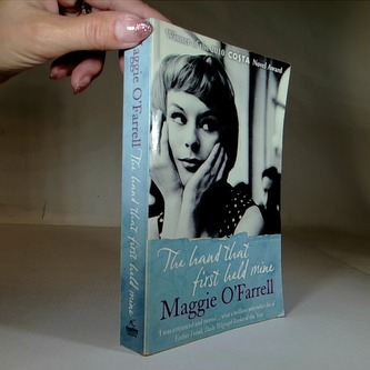 The hand that first held mine