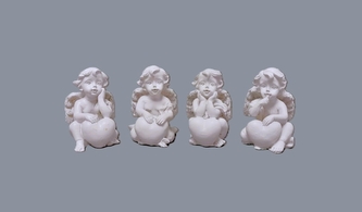 Anděl bílý sedící se srdcem